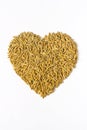 Natural rice grains in heart shape Royalty Free Stock Photo