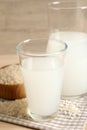 Natural rice water and grains on table, closeup