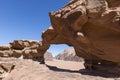 Natural rock bridge and panoramic view of Wadi Rum desert Royalty Free Stock Photo