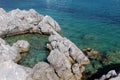 Natural rock pool on the rocky Mediterranean shores of Aegean Sea in Aquairum Bay, Turkey. Royalty Free Stock Photo