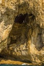 The natural rock statue of the Virgin Mary looks down upon the White Grotto on the Island of Capri, Italy Royalty Free Stock Photo