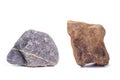 Natural rocks, black rough mountain rocks, red hard rocks for construction work on white background Royalty Free Stock Photo