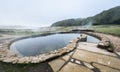 Natural Roman baths outdoors with hot steam and thermal water