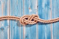 Natural Rope Double Figure Eight Knot on Blue Wood Royalty Free Stock Photo