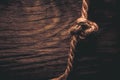 Natural rope on a wooden rustic texture for background. Rough we Royalty Free Stock Photo