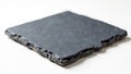 Natural rough black slate stone tile on white background Royalty Free Stock Photo