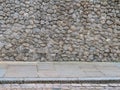 Ancient stone wall whith sidewalk Royalty Free Stock Photo