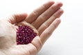 A natural ruby lies in the hand. Natural stones, ruby located in the female hand. The hand holds a ruby. Copy space for your text Royalty Free Stock Photo