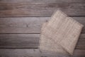 Natural sackcloth on grey wooden background. Canvas on grey wooden table Royalty Free Stock Photo