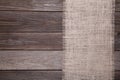 Natural sackcloth on grey wooden background. Canvas on grey wooden table Royalty Free Stock Photo