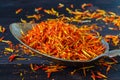 Natural saffron on wooden background Royalty Free Stock Photo