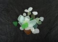 Natural Sea Glass, Beach Glass Stones, Polish Textured Seaglass, Transparent Pebbles on Black Background Royalty Free Stock Photo