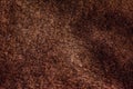 Macro of a fur. Natural short brown fur. Brown texture from the seamy side of the sheepskin coat