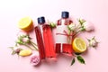 Natural shower gels and ingredients on pink background