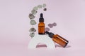 Natural skincare product in glass bottles with dropper. Serum for woman facial skin. Herbal mineral cosmetic on white concrete