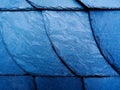 Natural slate tile roof detail. shiny dark blue and gray split face texture