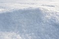 Natural snow texture of snowdrift. Winter backdrop with snowy ground. Patterns on snow surface. Royalty Free Stock Photo