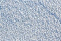 Natural snow texture. The surface of an icy snow crust. Snowy ground. Royalty Free Stock Photo