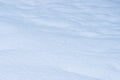 Natural snow texture. Wavy surface of clean fresh snow. Royalty Free Stock Photo