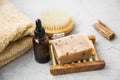 Natural soap, handmade organic natural soap with oil bottle and cotton towel, spa and wellness products still life setting, Royalty Free Stock Photo