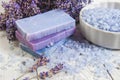 Natural soap, lavender, salt on a wooden board, hygiene items for bath and spa. Royalty Free Stock Photo