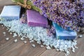 Natural soap, lavender, salt on a wooden board, hygiene items for bath and spa. Royalty Free Stock Photo