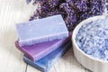 Natural soap, lavender, salt on a wooden board, hygiene items for bath and spa. Royalty Free Stock Photo