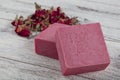 Natural soap, Rose Soap. Natural handmade soap with dried pink roses on wooden board. Spa Royalty Free Stock Photo