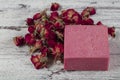 Natural soap, Rose Soap. Natural handmade soap with dried pink roses on wooden board. Spa Royalty Free Stock Photo