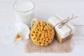 Natural soap set, Bath sponge , glass of milk and orchid flower, close up. Royalty Free Stock Photo