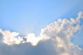 Natural soft clouds pattern and sunshine ray on blue sky background Royalty Free Stock Photo