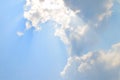 Natural soft clouds pattern and sunshine ray on blue sky background Royalty Free Stock Photo