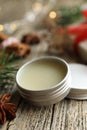 Natural solid perfume in container and anise star on wooden table, closeup Royalty Free Stock Photo