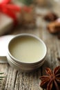Natural solid perfume in container and anise star on wooden table, closeup Royalty Free Stock Photo