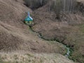 Natural source of water in the ravine, equipped with a house with a minaret in a village near Kazan, Tatarstan, Russia