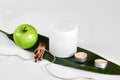 Natural spa beauty treatment cleansing products with apple on white background. Royalty Free Stock Photo