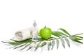 Natural spa beauty treatment cleansing products with apple on white background. Royalty Free Stock Photo