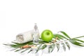 Natural spa beauty treatment cleansing products with apple on white background. Royalty Free Stock Photo