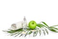 Natural spa beauty treatment cleansing products with apple on white background. Royalty Free Stock Photo