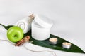 Natural spa beauty treatment cleansing products with apple on white background. Royalty Free Stock Photo