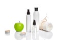 Natural spa beauty treatment cleansing products with apple on white background. Royalty Free Stock Photo