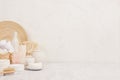 Natural spa white cosmetics products and beige bamboo rustic decor on white wood background, interior, border.