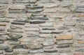 Close-up a concrete wall with the smooth sea boulders in it. Royalty Free Stock Photo