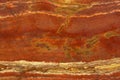 Natural stone in the colors of a lush lava with a white vein called Travertin Rosso