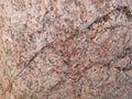 Natural stone granite background texture. Bright hard red granitic rock texture. Royalty Free Stock Photo