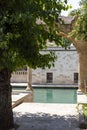 Natural stone historical building and pool view.