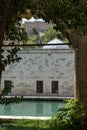 Natural stone historical building and pool view.