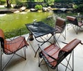 Natural stone pond and wooden chair