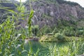 Natural stone pool under the mountain