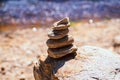 Natural stone pyramids on the river bank. Stone balance close up.Close-up abstract image of stones balanced like pyramid Royalty Free Stock Photo